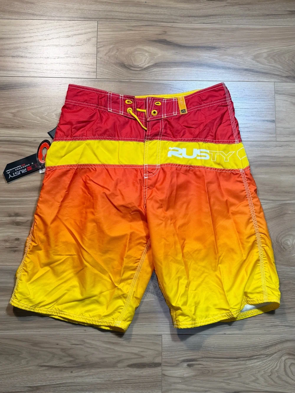Brand new with tags Rusty Men’s Gradient Red-Orange-Yellow Swim Trunks